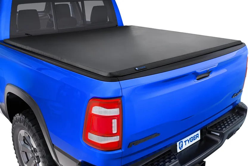 Tyger Auto T3 soft tri-fold tonneau cover shown folded and installed on a pickup bed