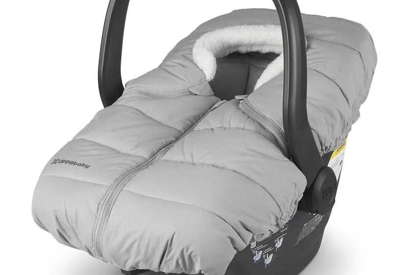 UPPAbaby CozyGanoosh light grey ultra-plush weatherproof cover fitted over a Mesa infant carrier