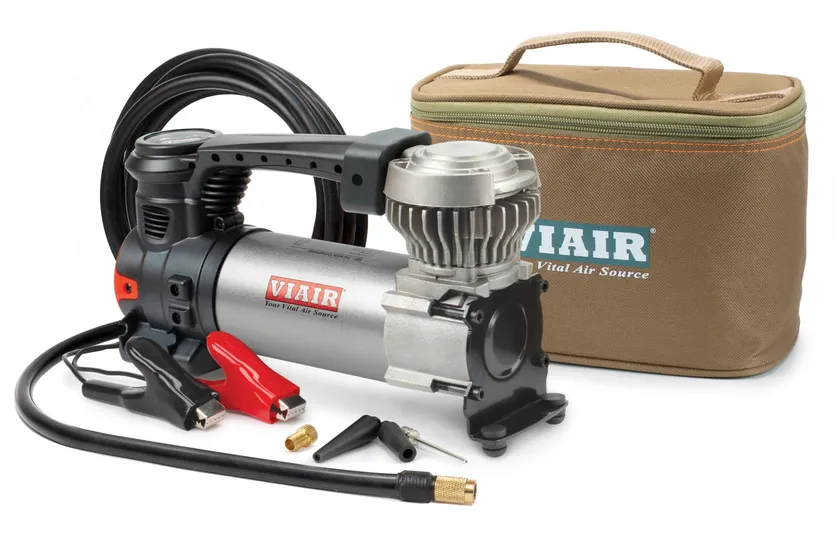 VIAIR 88P silver and black portable 12V air compressor with battery alligator clamps, air hose and carry bag